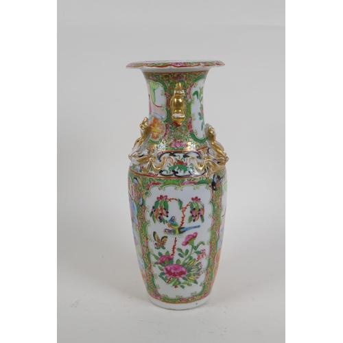 264 - A Chinese C19th Cantonese famille rose porcelain vase with gilt fo-dog handles and decorative panels... 