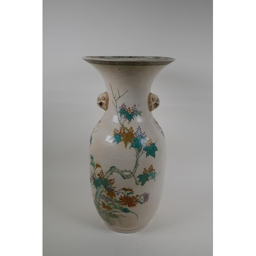 265 - A Japanese Meiji Satsuma vase, with twin mask handles, decorated with a phoenix in flight, 48cm high