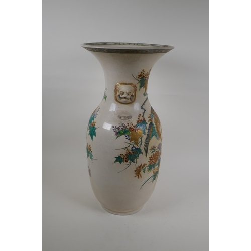 265 - A Japanese Meiji Satsuma vase, with twin mask handles, decorated with a phoenix in flight, 48cm high