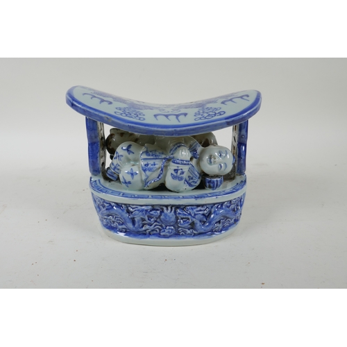 272 - An early C20th Chinese blue and white porcelain pillow with figural and dragon decoration, 17 x 10 x... 