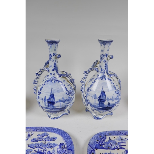 274 - A pair of Delft Royal Bonn porcelain vases with two handles, together with two Delft slender necked ... 