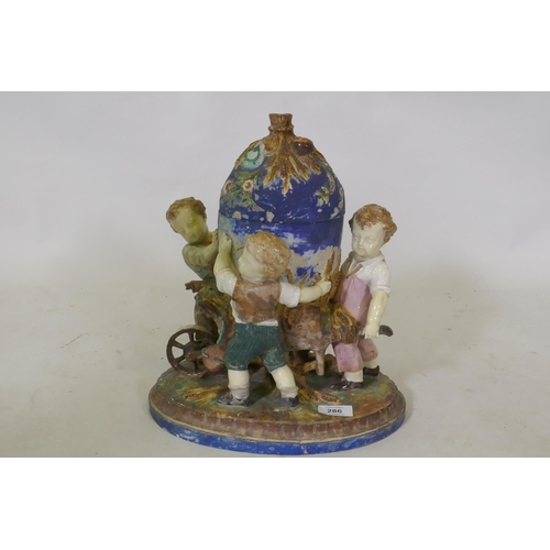 299 - C19th Majolica ceramic centrepiece in the form of three boys with a wheelbarrow, AF, 36cm high