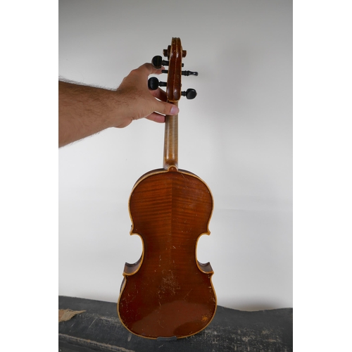 302 - A violin and bow, the neck of the violin stamped RMB 1206, in a carry case, violin 59cm long