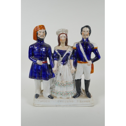 31 - A Victorian Staffordshire  pottery flatback figure group, 'Turkey, England, France', 27cm high