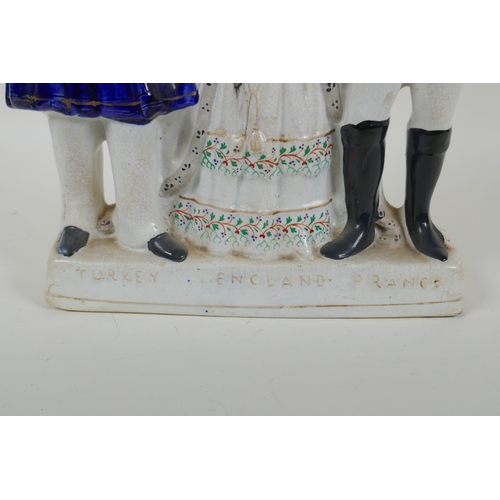 31 - A Victorian Staffordshire  pottery flatback figure group, 'Turkey, England, France', 27cm high