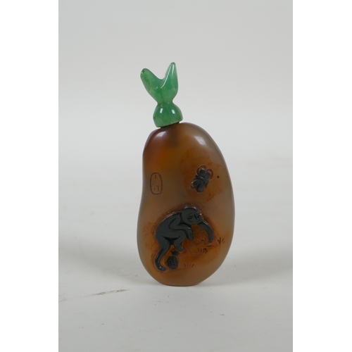 33 - A Chinese antique agate snuff bottle decorated with a monkey and deer, with later hardstone stopper,... 