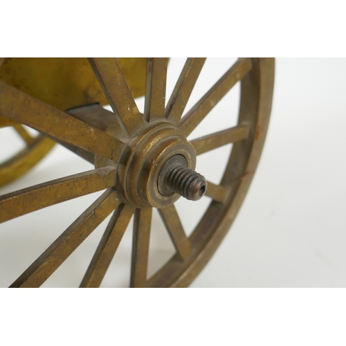 39 - An antique bronze table canon, 33cm long, AF missing wheel nuts