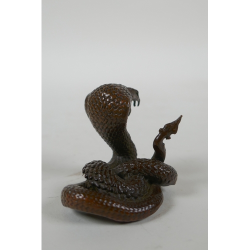 42 - A Japanese style bronze okimono cobra, 4cm high