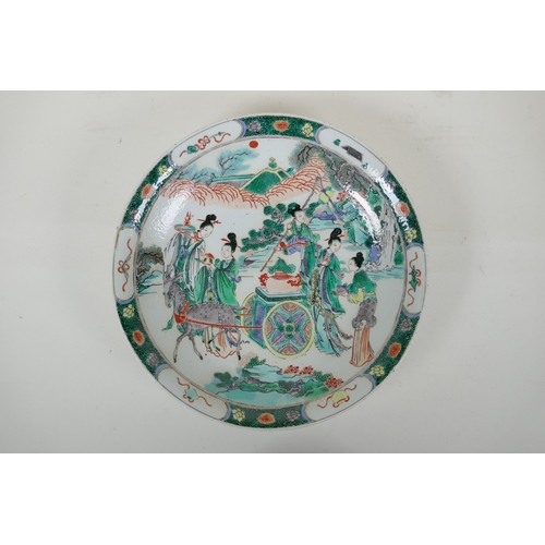 48 - A Chinese KangXi style famille vert porcelain charger decorated with female travellers and deer draw... 