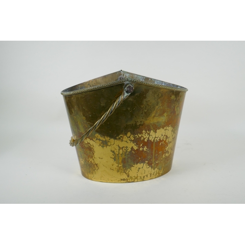 49 - An antique brass ice bucket with a braided handle, 30 x 21cm