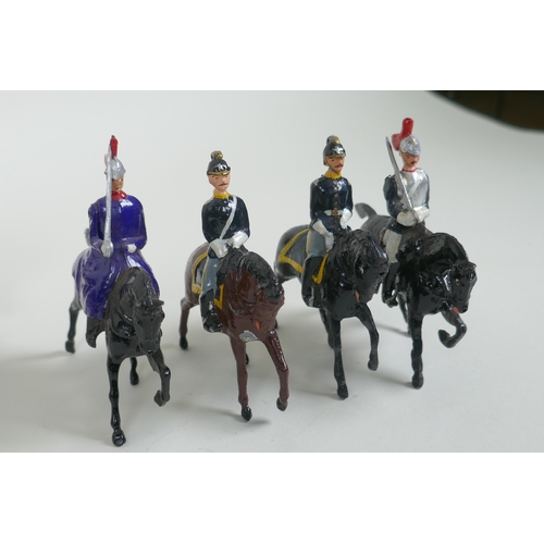 53 - A quantity of Britains lead soldiers, mostly Cavalry units, and some miscellaneous metal figures, 8c... 