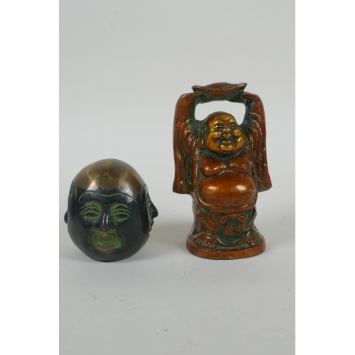 56 - A Sino Tibetan bronze figure of a jolly Buddha, and a bronze four faced Buddha head, largest 9cm hig... 