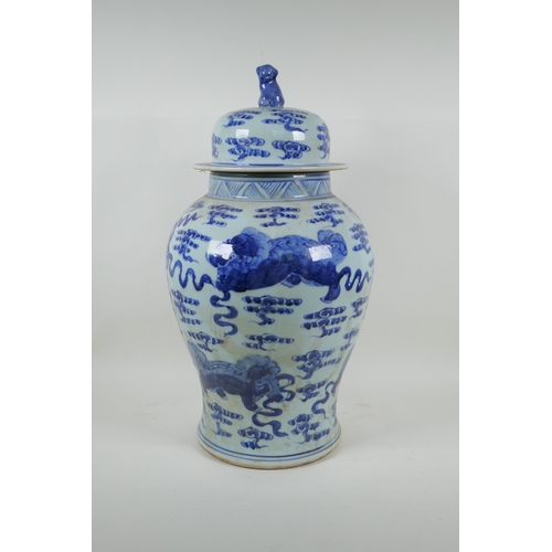 58 - A Chinese blue and white porcelain jar and cover, decorated with kylin, 53cm high