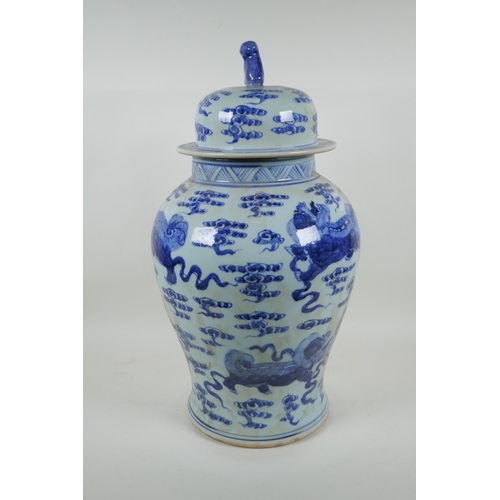 58 - A Chinese blue and white porcelain jar and cover, decorated with kylin, 53cm high