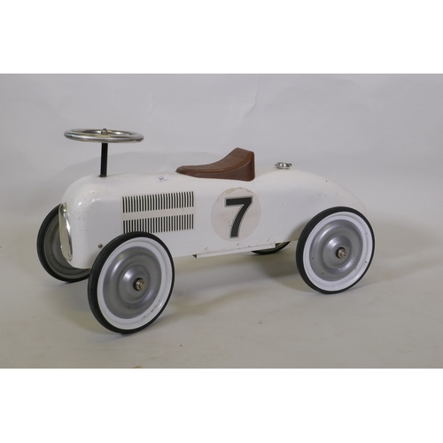 61 - A child's toy metal racing car, 72cm long