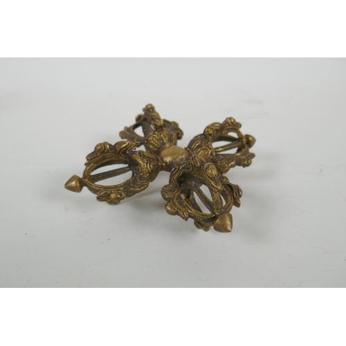 64 - A Tibetan gilt metal double vajra, 15 x 15cm