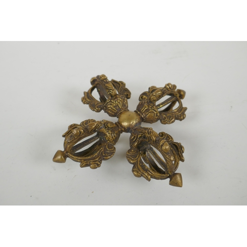 64 - A Tibetan gilt metal double vajra, 15 x 15cm