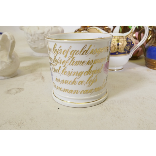 67 - A C19th creamware mug, with hand painted floral decoration and inscription in gilt, 9cm high, and a ... 