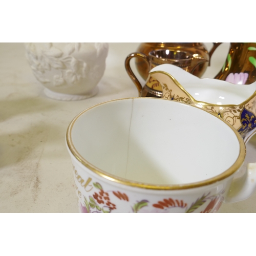 67 - A C19th creamware mug, with hand painted floral decoration and inscription in gilt, 9cm high, and a ... 