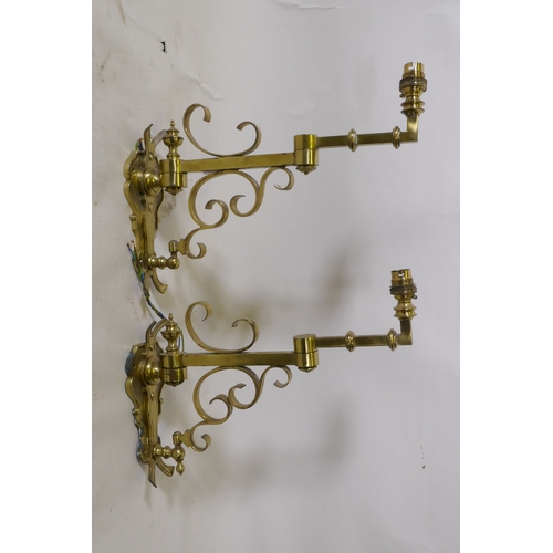 69 - A pair of brass two fold wall sconces, 25cm high, 36cm extended