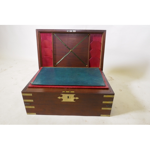 70 - A C19th mahogany campaign writing slope with brass mounts and military style carrying handles, the i... 