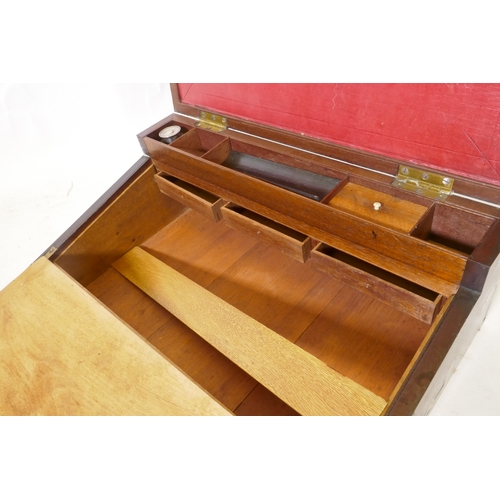 70 - A C19th mahogany campaign writing slope with brass mounts and military style carrying handles, the i... 