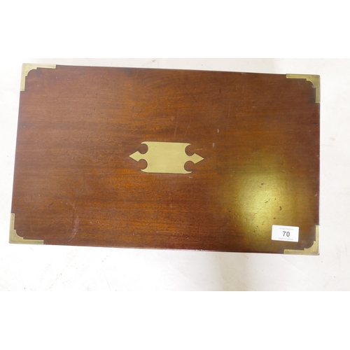 70 - A C19th mahogany campaign writing slope with brass mounts and military style carrying handles, the i... 