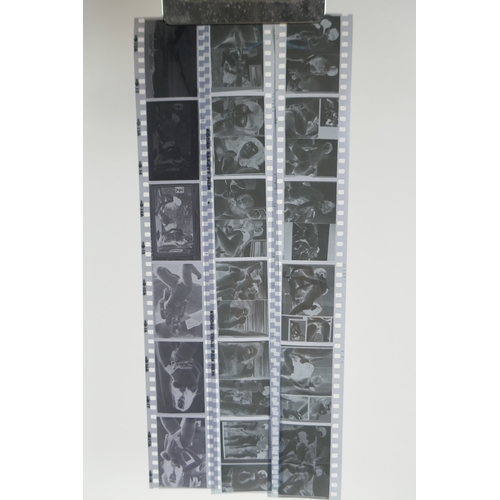 71 - Two sheets of 1960s/70s risque erotic negatives, 35mm, 83 images