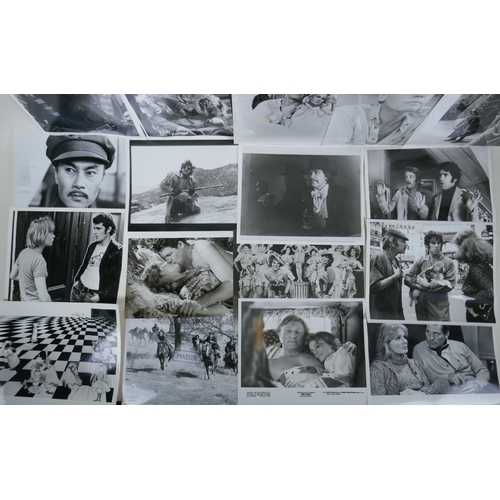 73 - A quantity of movie press photographs to include Donald Sutherland, Robert Shaw, Ursula Andres, Char... 