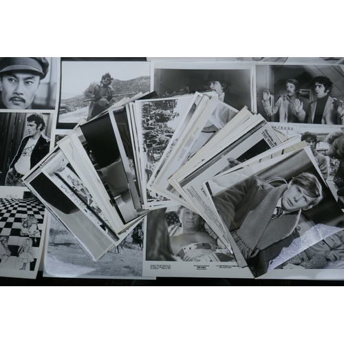 73 - A quantity of movie press photographs to include Donald Sutherland, Robert Shaw, Ursula Andres, Char... 