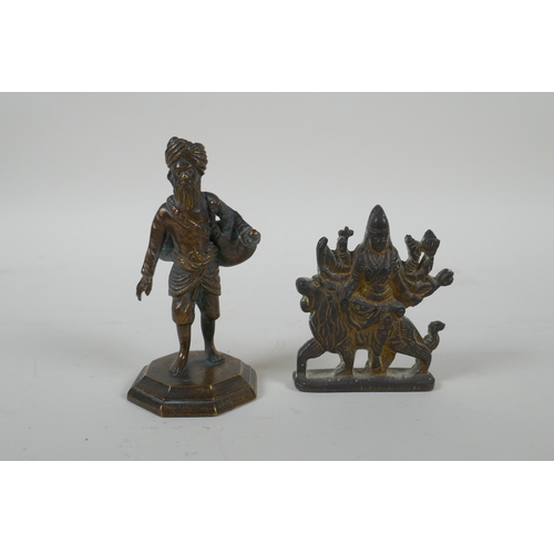 85 - An Indian cast bronze Sikh watercarrier, and an Indian gilt bronze figure of the goddess Mata, large... 