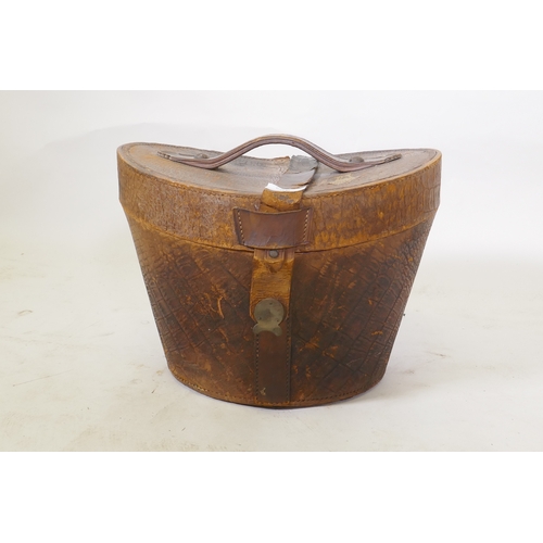 86 - A C19th leather hat box with red silk lining, 26cm high