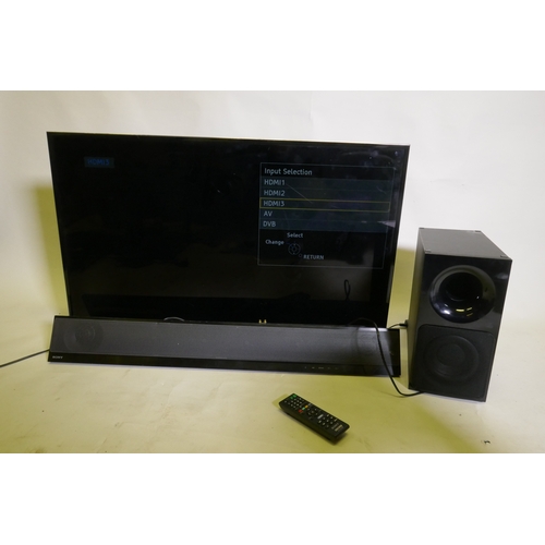 97 - Panasonic TX-40DX600B 4K LDC TV, and a Sony SA-CT390 sound bar and sub woofer, AF, tv screen marked