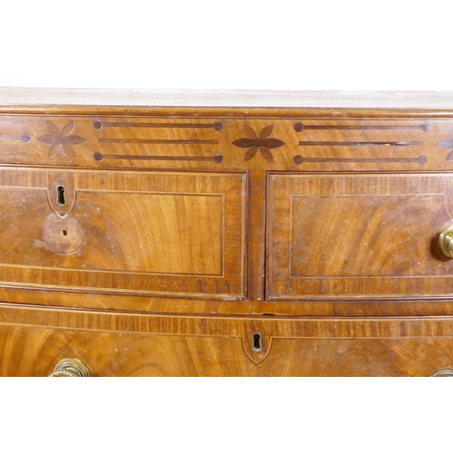 1148 - A Regency mahogany bowfront chest, with inlaid frieze and two over three drawers, flanked by reeded ... 