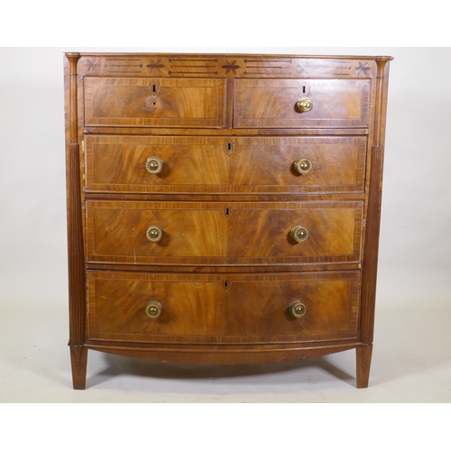 1148 - A Regency mahogany bowfront chest, with inlaid frieze and two over three drawers, flanked by reeded ... 