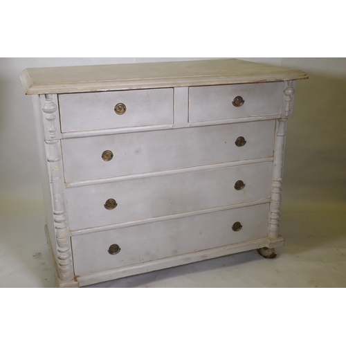 1172 - A C19th continental pine commode of two over three drawers flanked by column mouldings, raised on tu... 