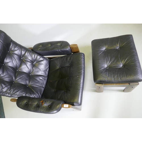 1059 - A mid century Ekornes leather reclining chair with ash frame and matching footstool