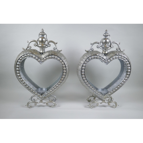 107 - A pair of silvered metal heart shaped lanterns, 52cm high