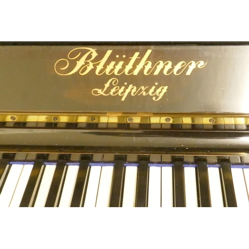 1070 - A 1920s Julius Bluthner upright pianoforte supplied by Waring and Gillow, with iron frame, No.107494... 