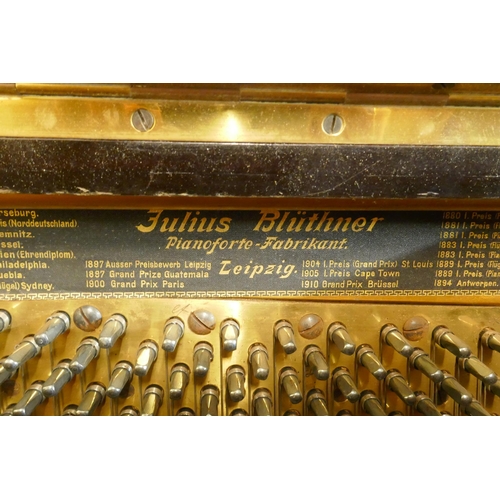 1070 - A 1920s Julius Bluthner upright pianoforte supplied by Waring and Gillow, with iron frame, No.107494... 