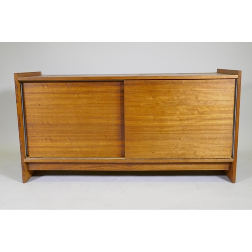 1071 - A mid century rosewood side cabinet with two slide doors, 125 x 46 x 65cm