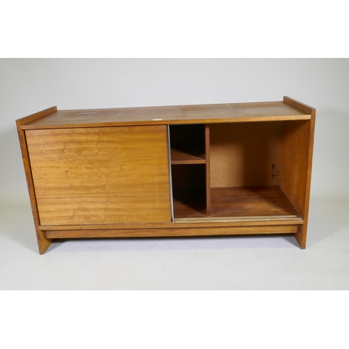 1071 - A mid century rosewood side cabinet with two slide doors, 125 x 46 x 65cm