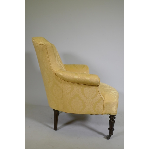 1073 - A C19th bow back arm chair with shaped front, raised on turned supports with brass castors