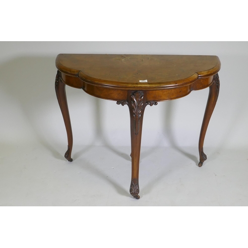 1075 - Victorian inlaid burr walnut shaped top card table, fitted with drawer to back, raised on carved cab... 