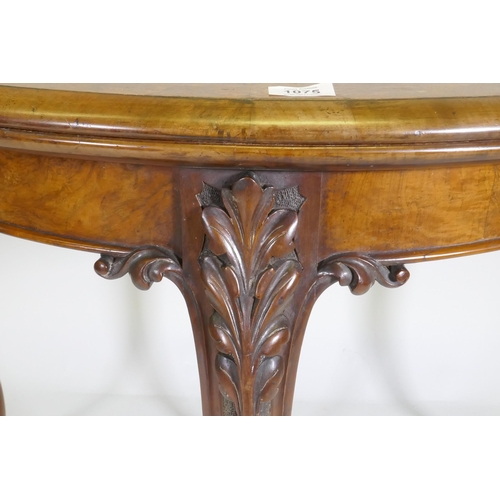 1075 - Victorian inlaid burr walnut shaped top card table, fitted with drawer to back, raised on carved cab... 