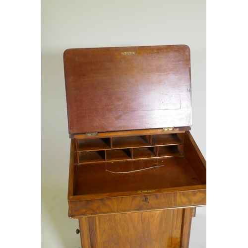 1077 - A Victorian inlaid figured walnut davenport, with pierced gallery over two drawers, one fitted with ... 