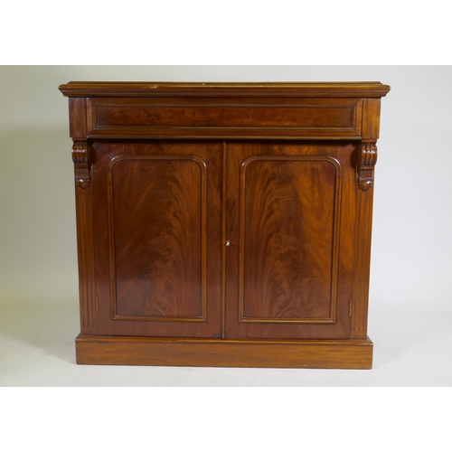 1079 - A C19th mahogany chiffonier, with single frieze drawer over two cupboards, raised on a plinth base, ... 