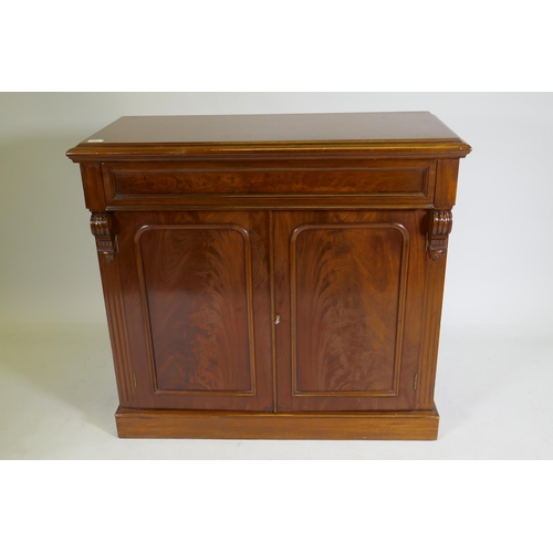 1079 - A C19th mahogany chiffonier, with single frieze drawer over two cupboards, raised on a plinth base, ... 