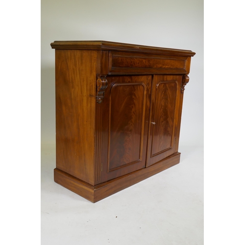 1079 - A C19th mahogany chiffonier, with single frieze drawer over two cupboards, raised on a plinth base, ... 