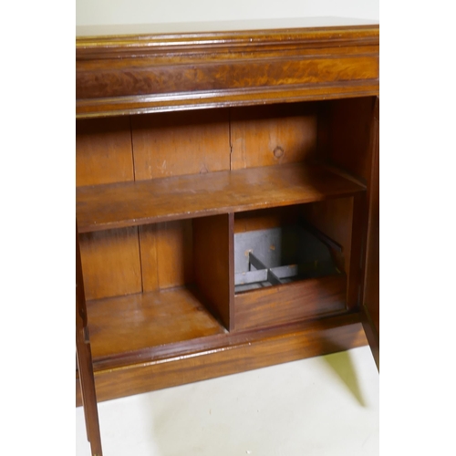 1079 - A C19th mahogany chiffonier, with single frieze drawer over two cupboards, raised on a plinth base, ... 